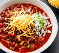 2 - bowl of chili with cheese and onions add